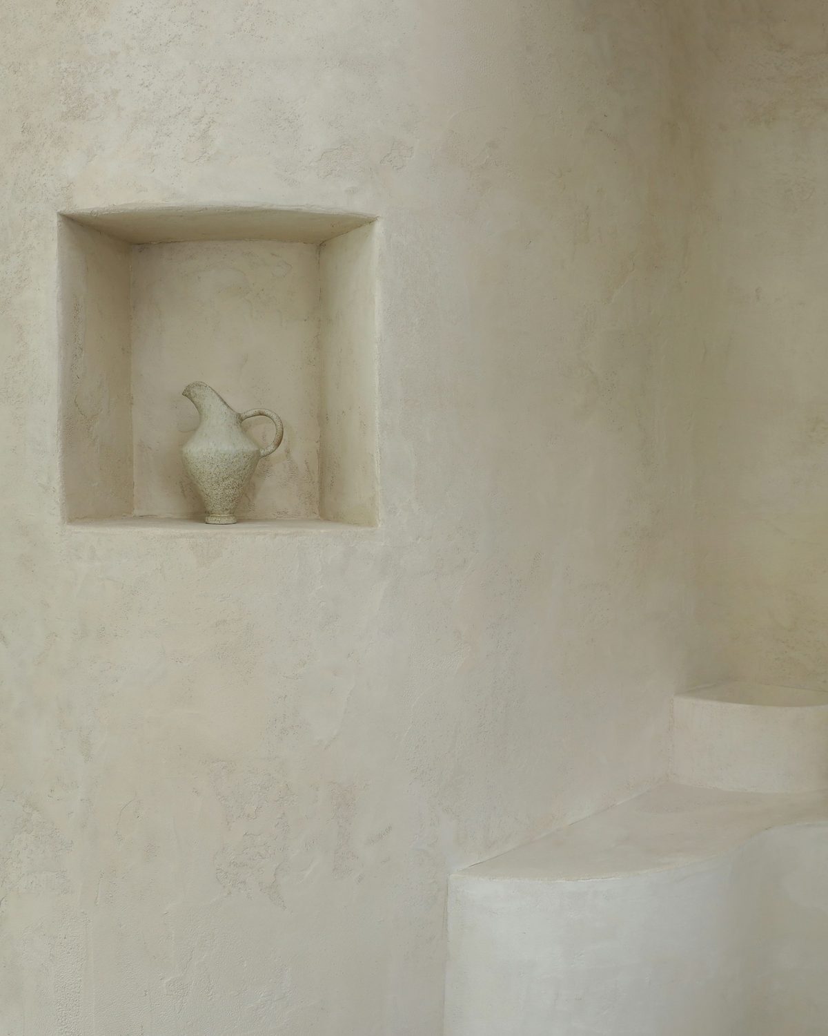 Hand-troweled Venetian plaster wall with a recessed display niche